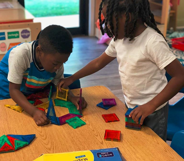 African american little boys playing with colorful magnetic building blocks at a Christian Preschool & Daycare Serving Loganville, GA