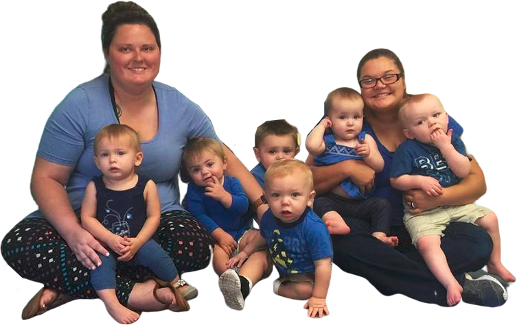 Happy teachers and cute little babies wearing blue at a Christian Preschool & Daycare Serving Loganville, GA